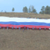 Российский триколор развернут на главной площади Якутии в День Государственного флага 
